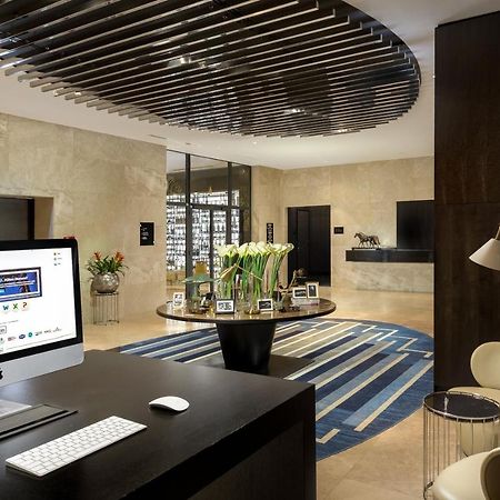 Doubletree By Hilton Minsk Hotel Bagian luar foto The lobby of the hotel